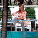 Jennifer Aniston sunbathing in bikini at her hotel in Miami Beach